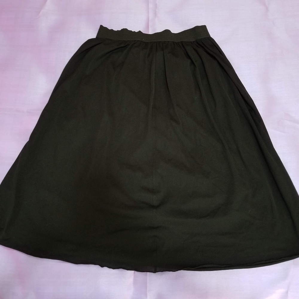 Black knee high skirt.